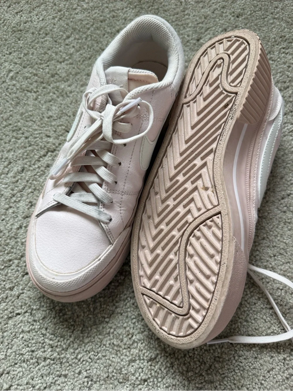 Nike Women’s Light Pink Low-Top Sneakers with White Swoosh